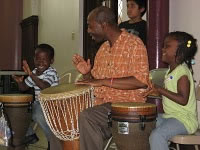 Drumming teacher at refugee class